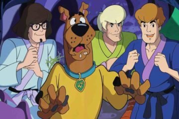 Scooby Doo Unmasked with Batman and the gang during sunset adventure